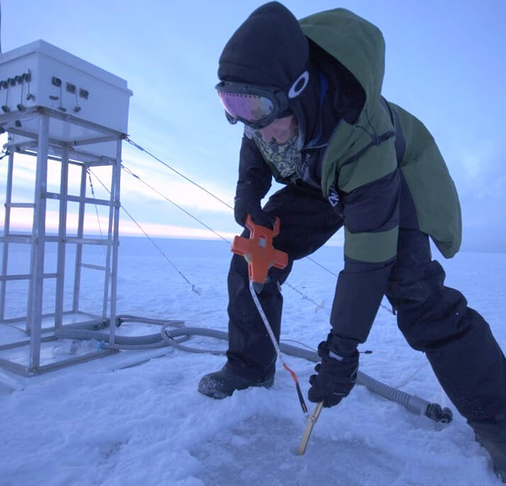 Researcher using Kovacs Ice Thickness Gauge