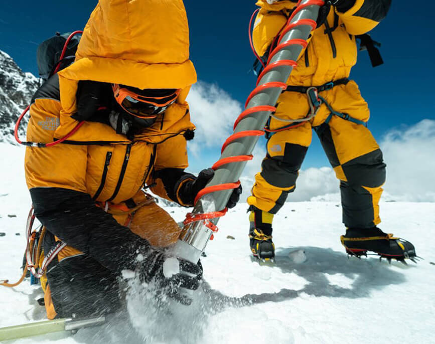 Two researchers use Kovacs Ice Coring Systems to take ice core samples